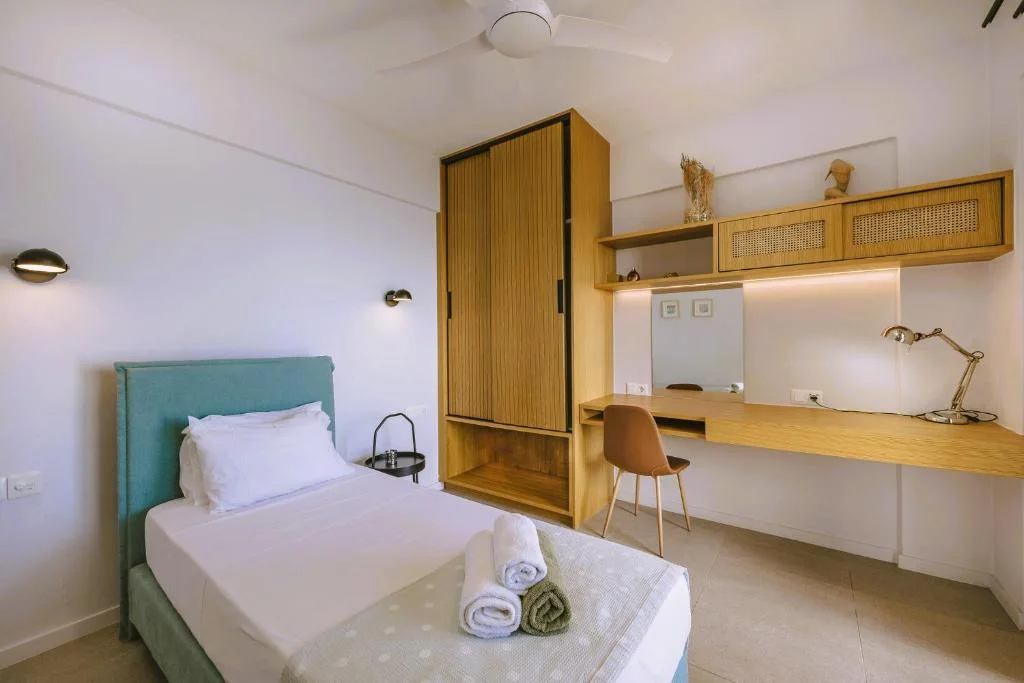 The third bedroom, with its single bed, wardrobe and desk