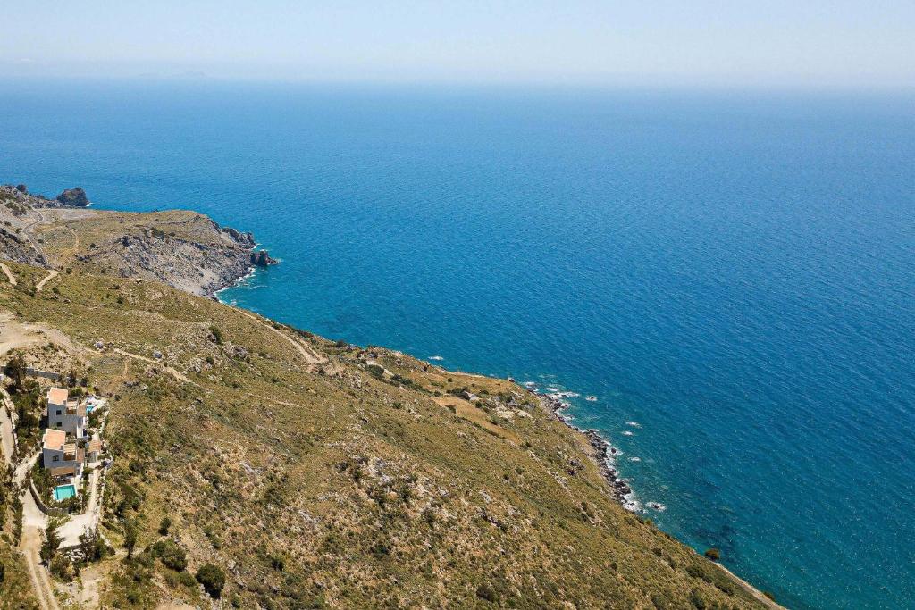 Aerial view of the villas on the Rodakino clifftop above the Libyan Sea
